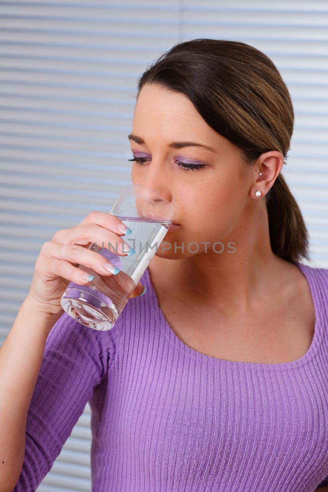 Woman drinking a glass of water