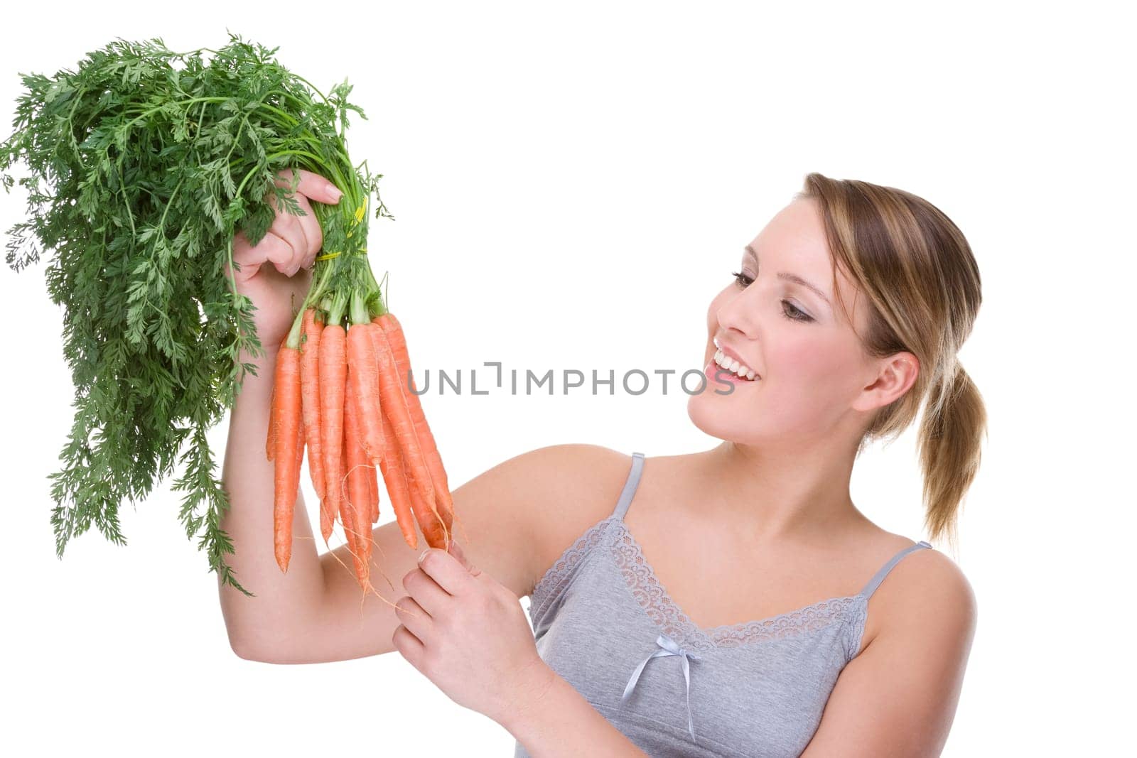 Young woman with carrots