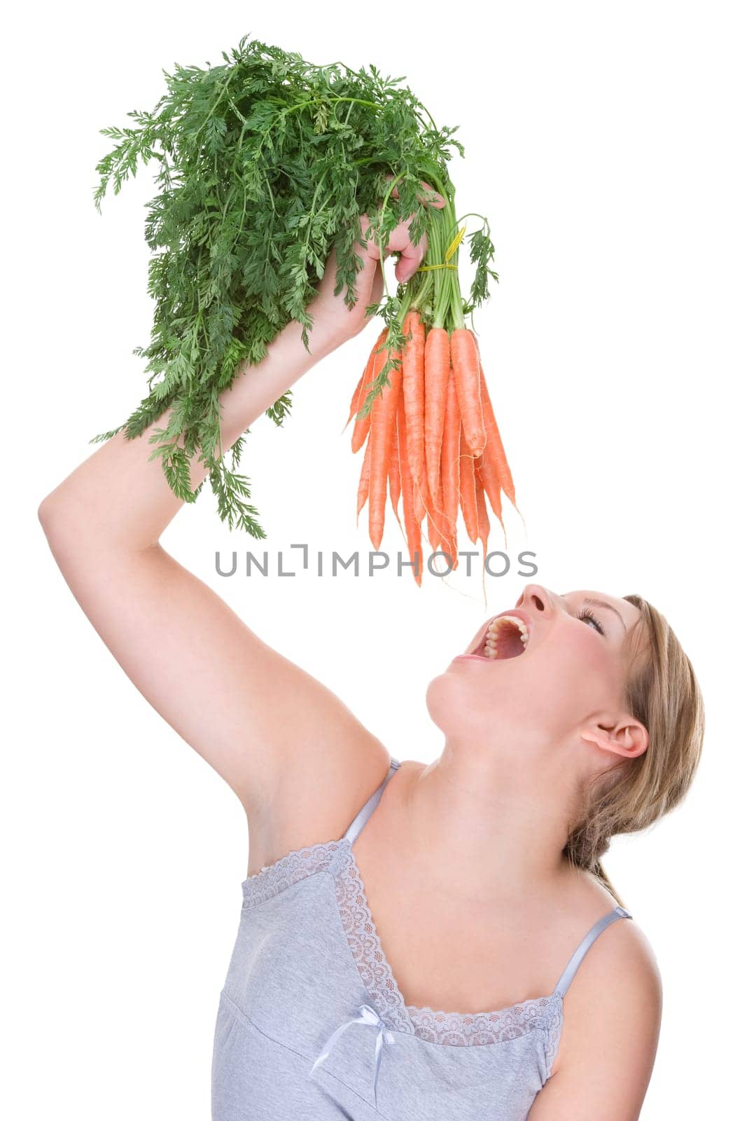 Young woman with carrots