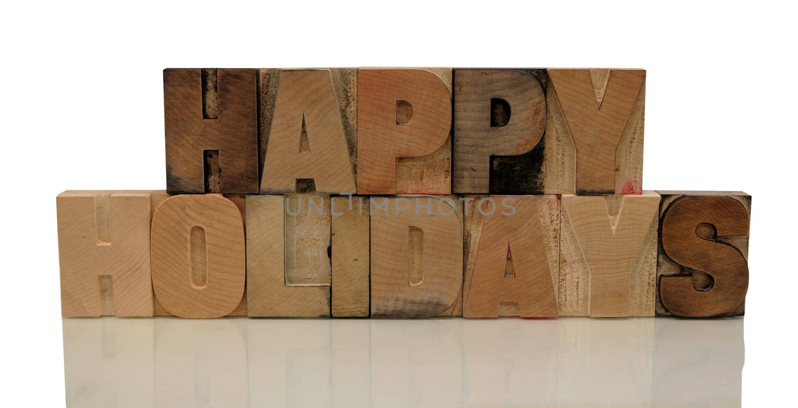 happy holidays in letterpress wood type