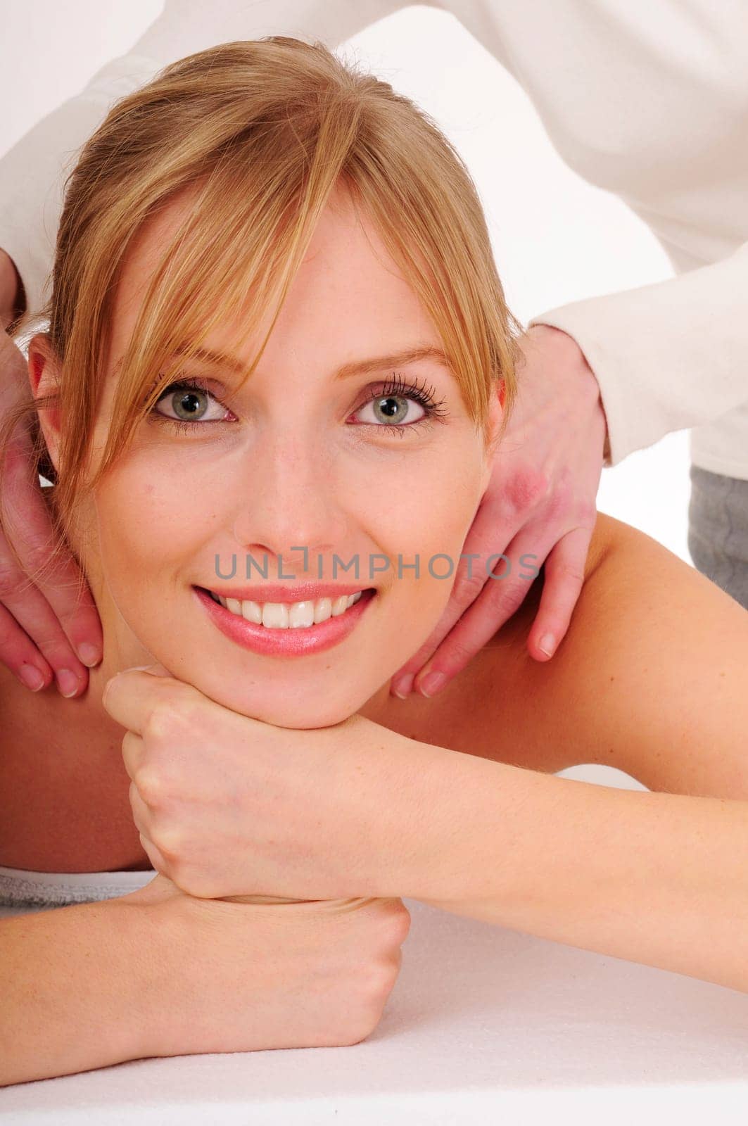 Blonde woman receives a relaxing massage