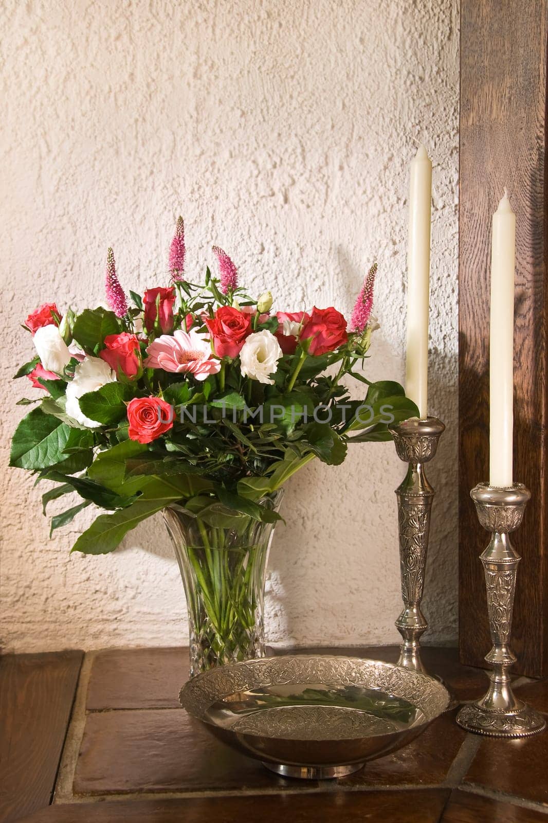 Stillife with silver candles, bowl and flowers