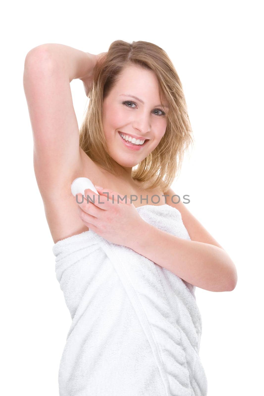 Young woman with deodorant roller