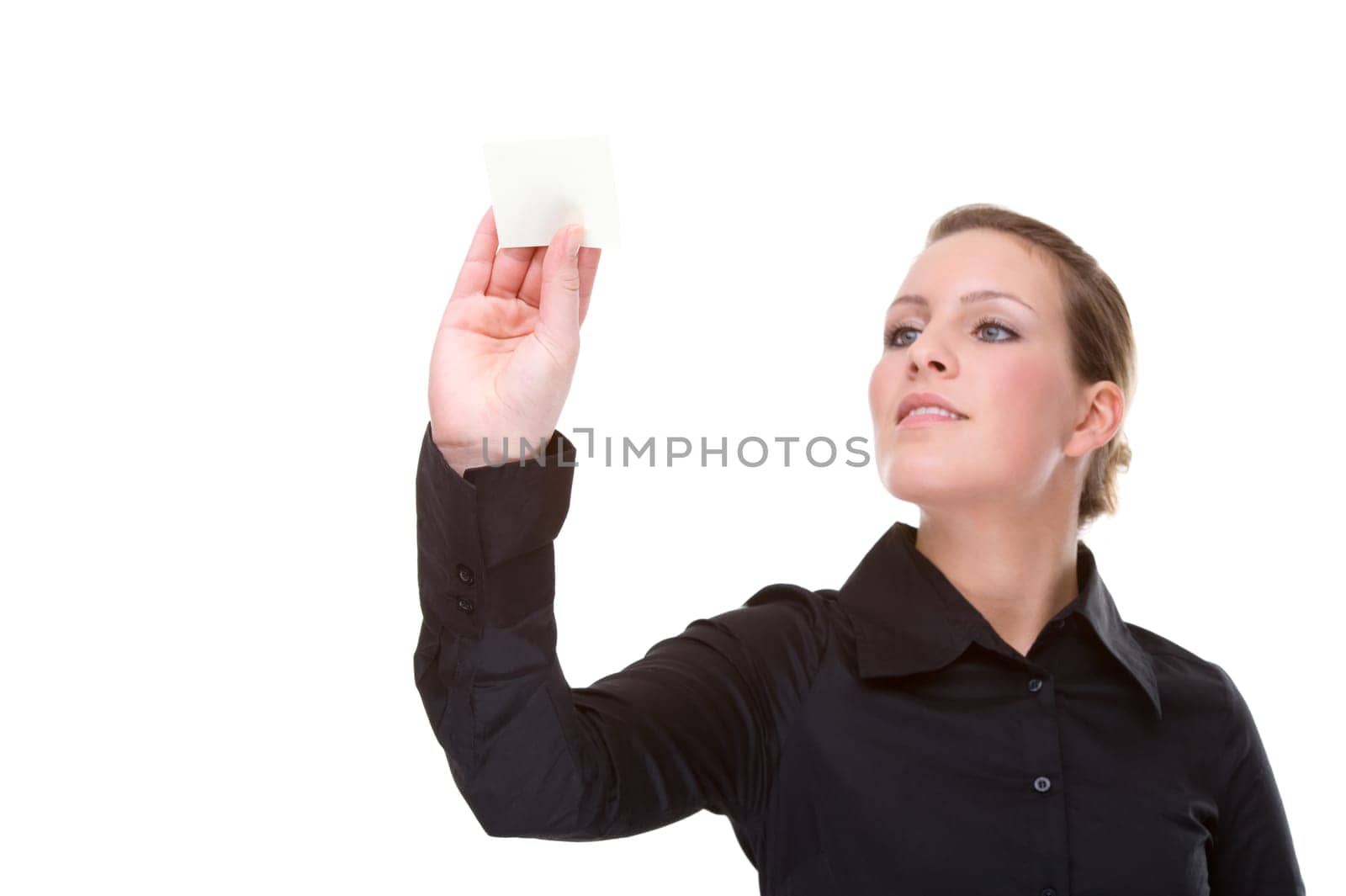 Businesswoman sticking notes on wall