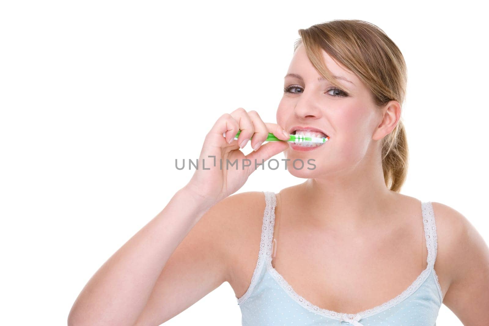 Young woman brushing her teeth
