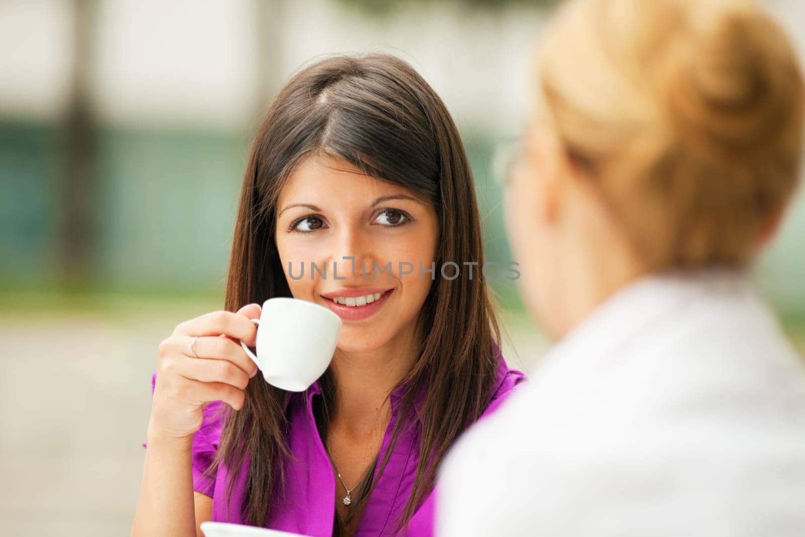 businesswomen drinking coffee