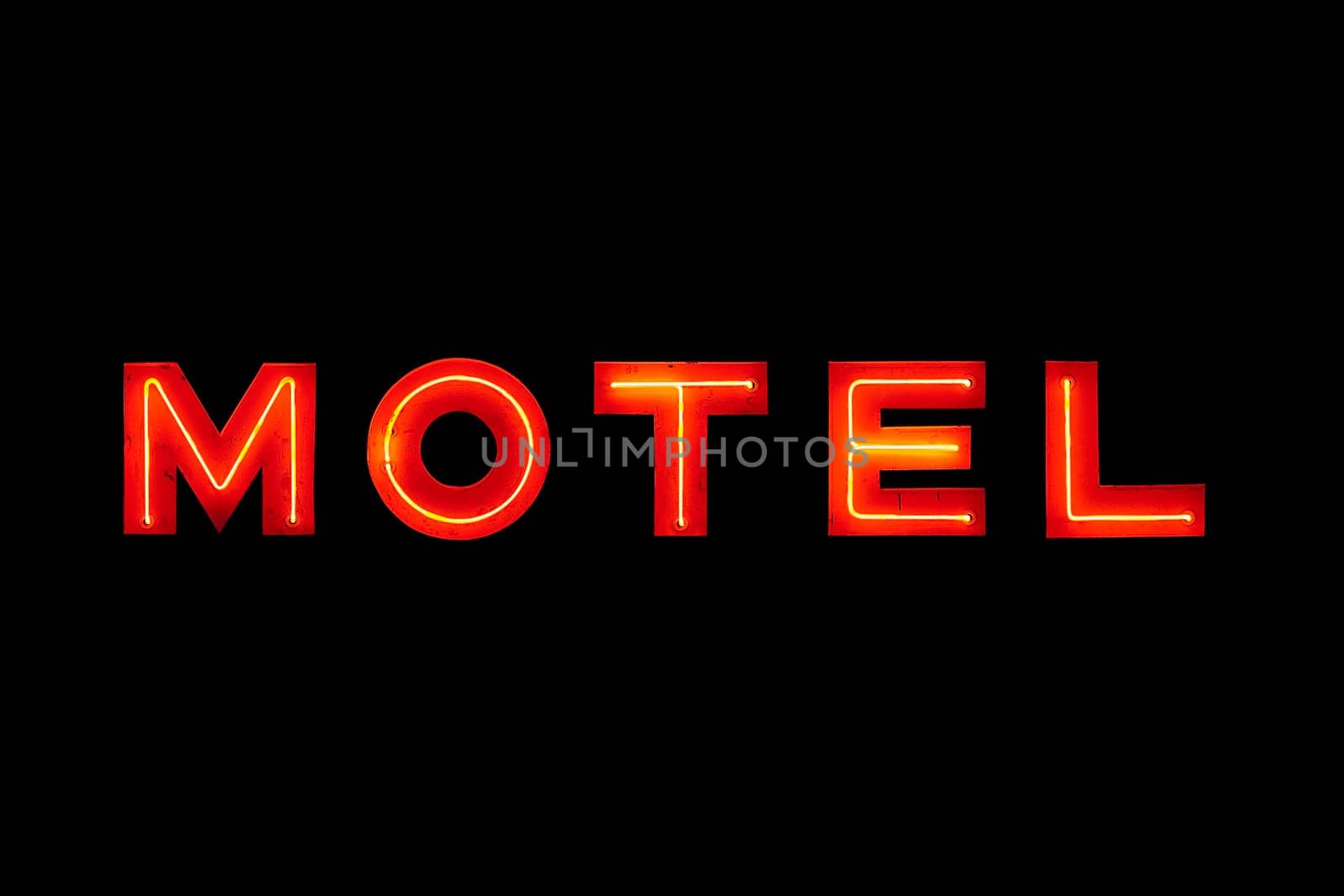 Motel neon sign isolated on black