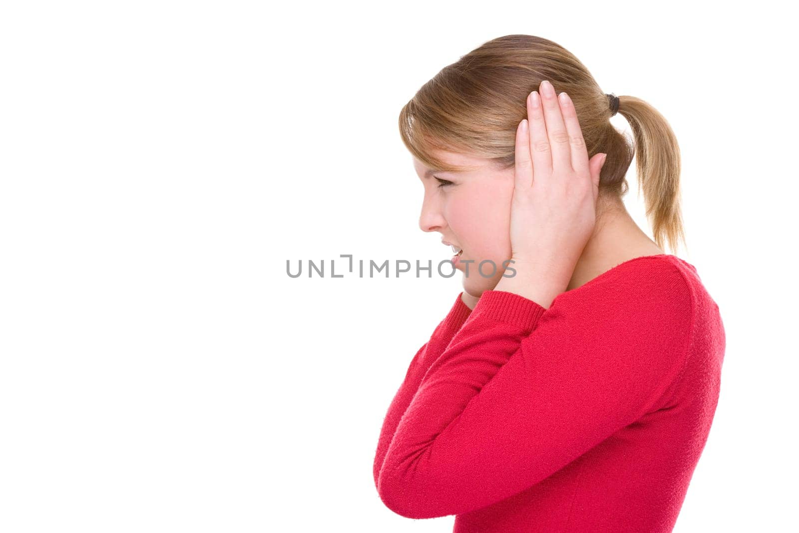 Woman covering her ears