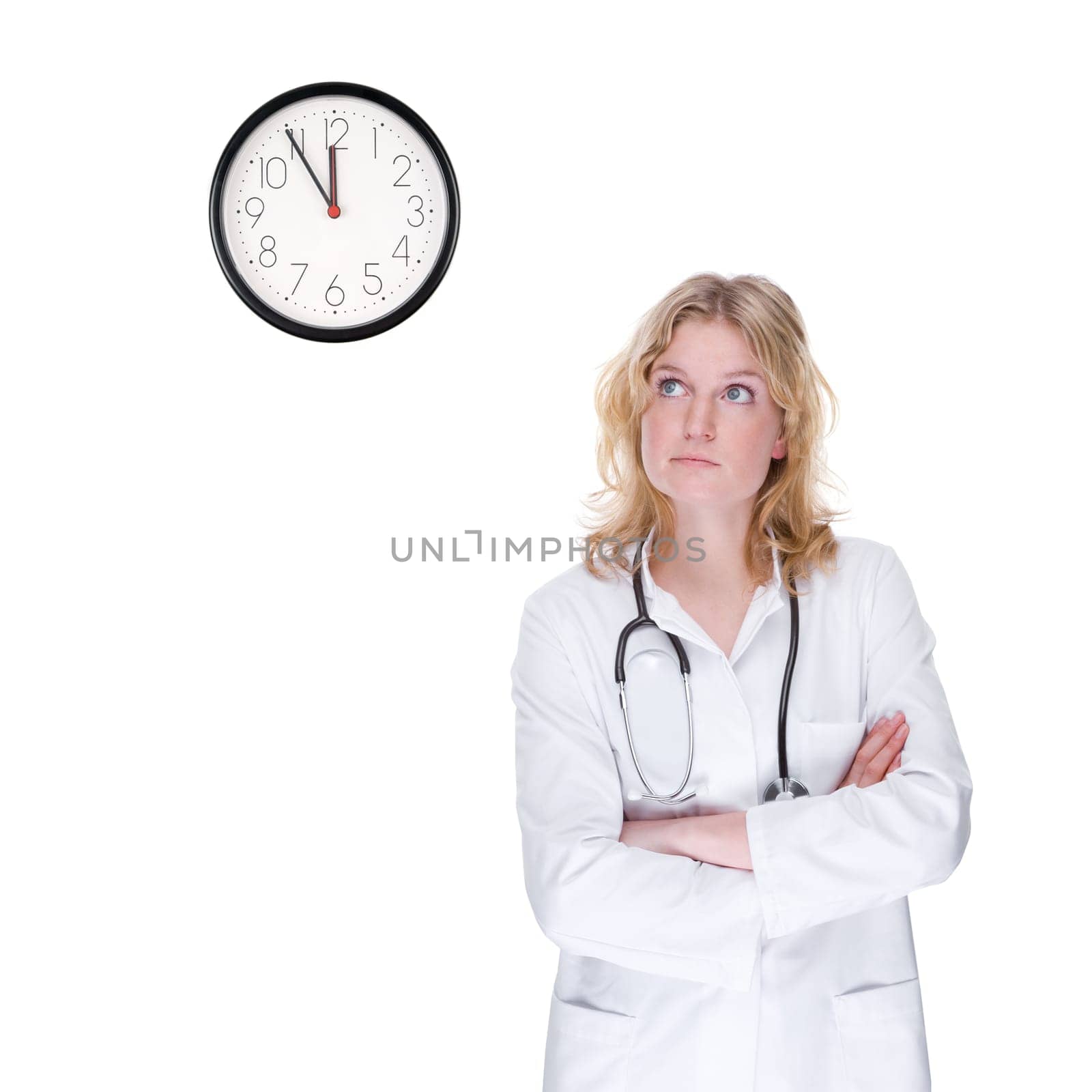Young female doctor looking at the clock