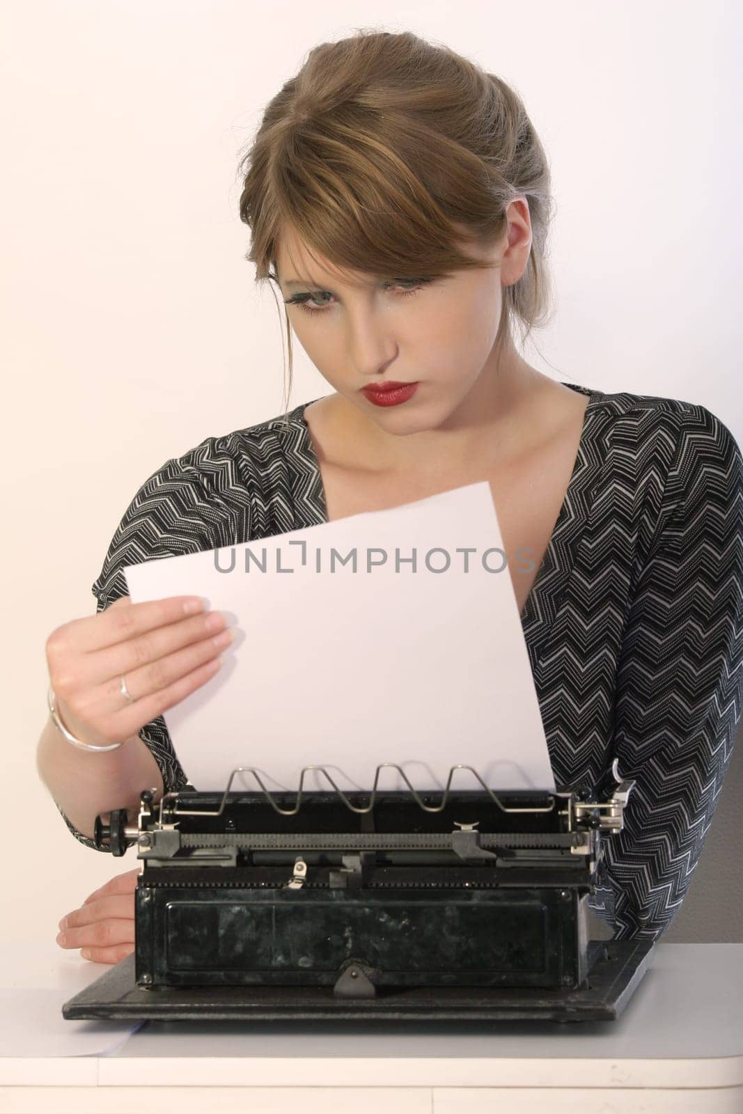 reading letter on typewriter