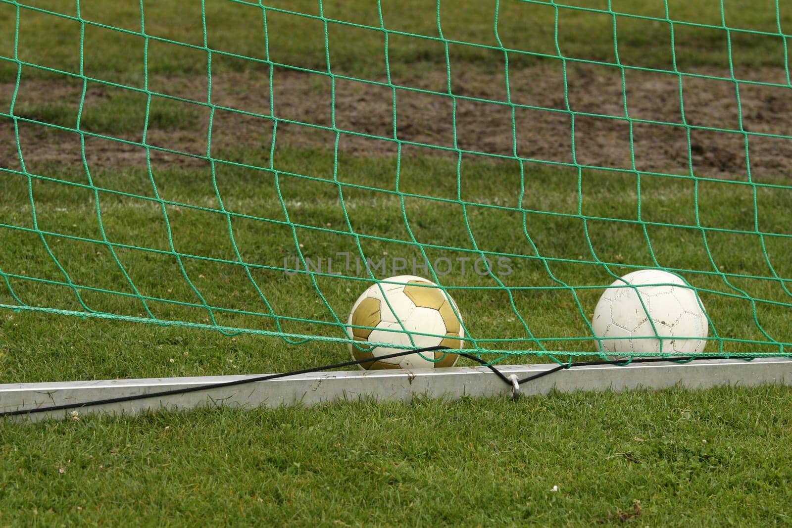 soccer balls in goal