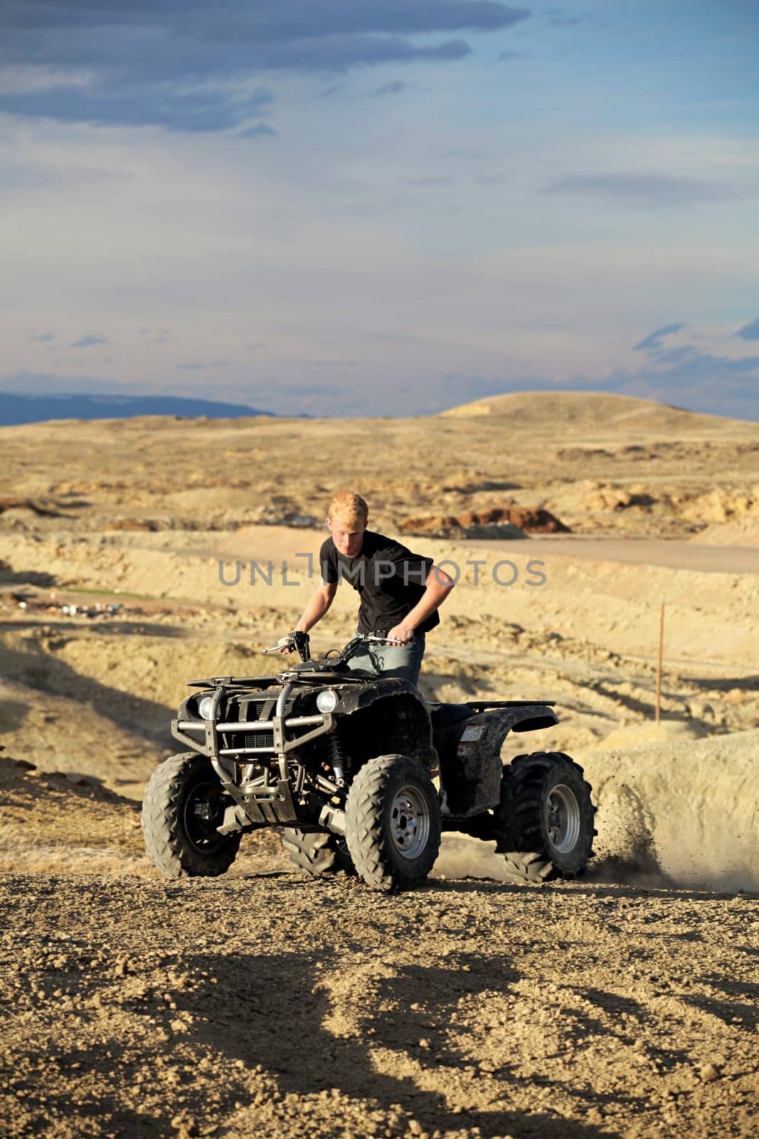 quad ATV in hills - teen on four wheeler