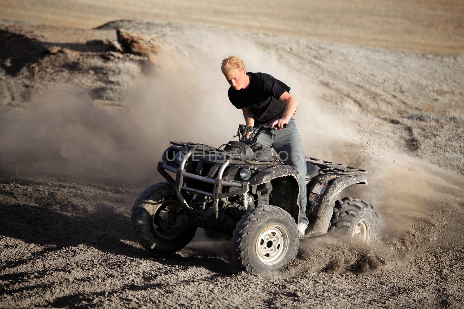 teenager riding quad - four wheeler ATV