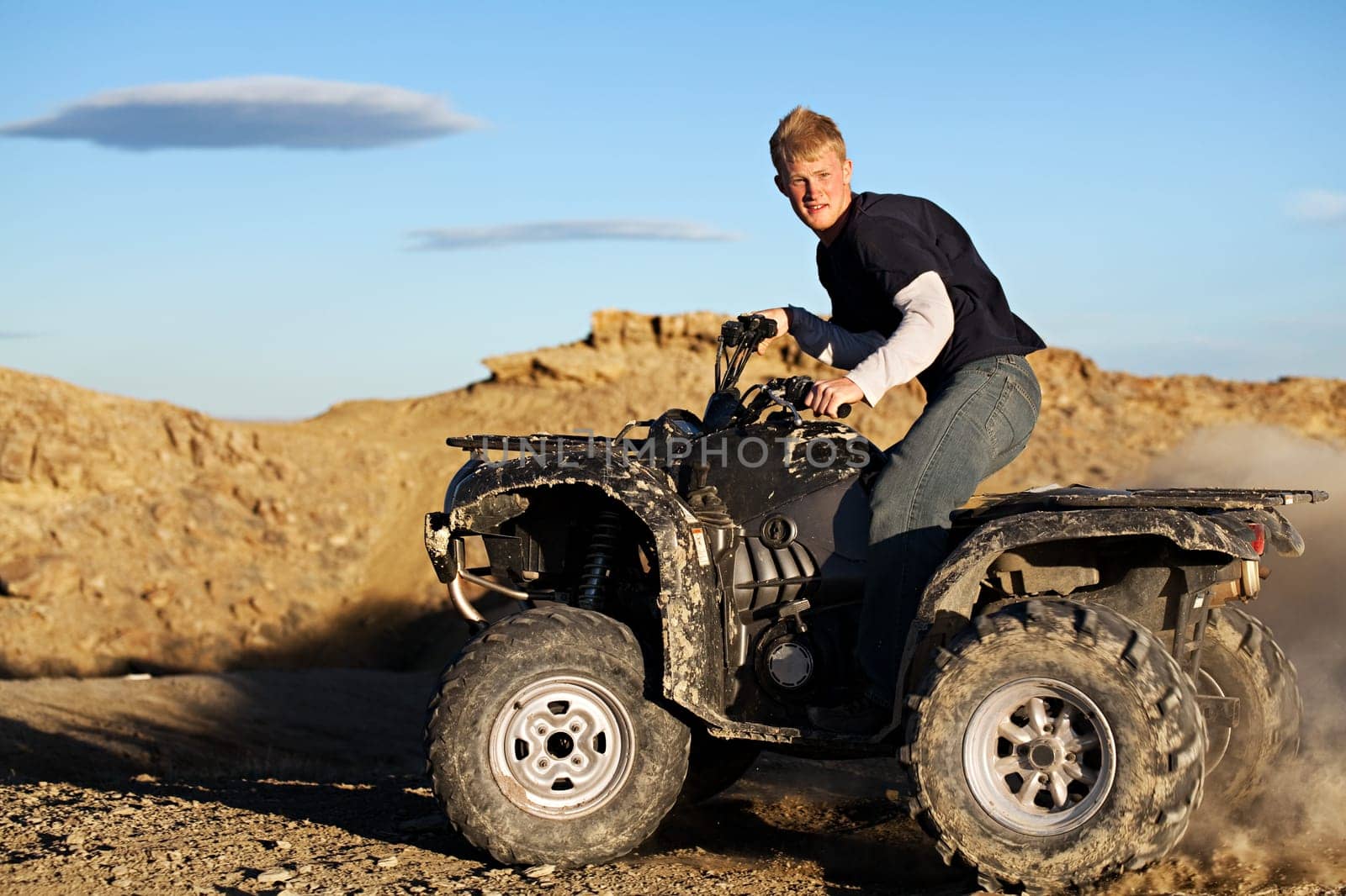 quad - teen driving four wheeler