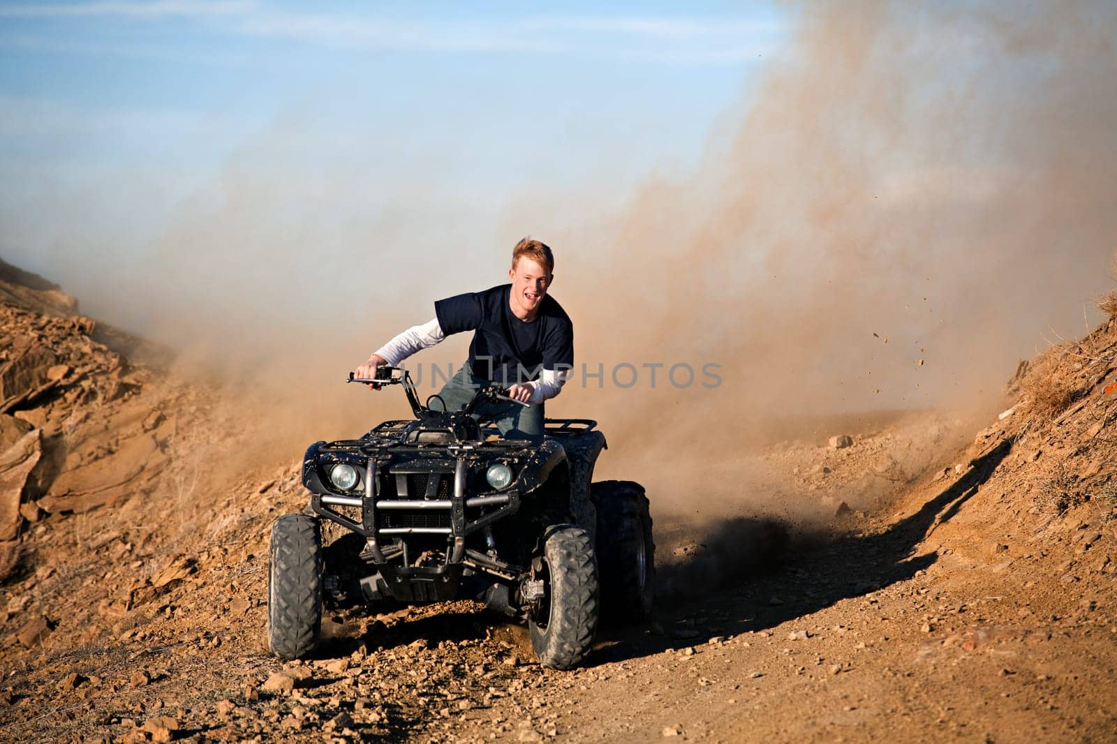 teenager riding quad four wheeler