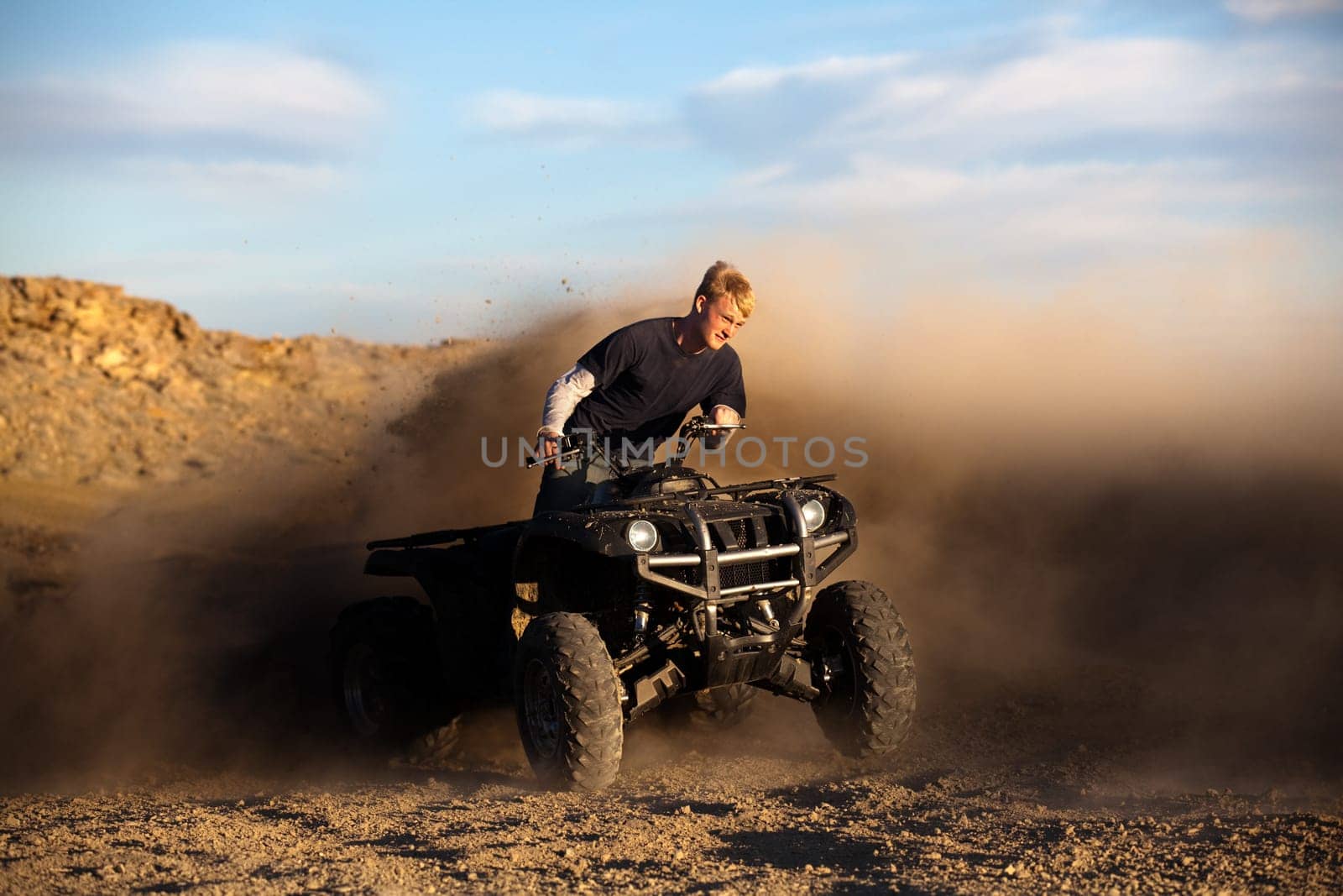 riding ATV - teen on quad