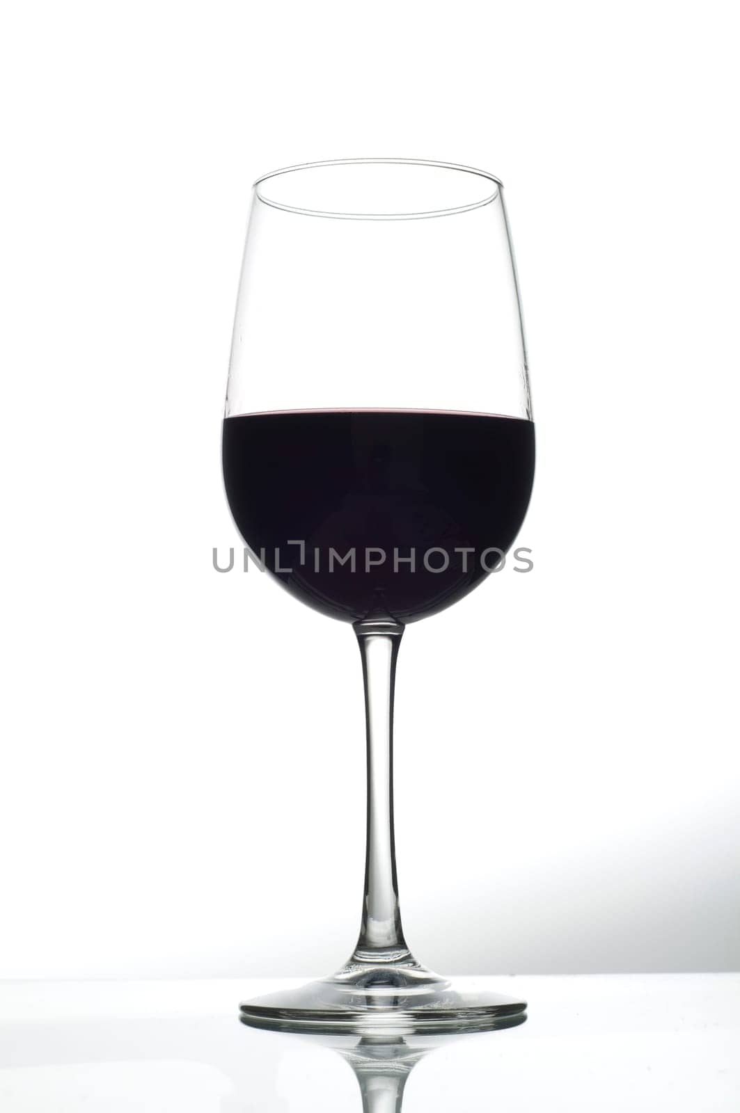 one wine glass with red wine