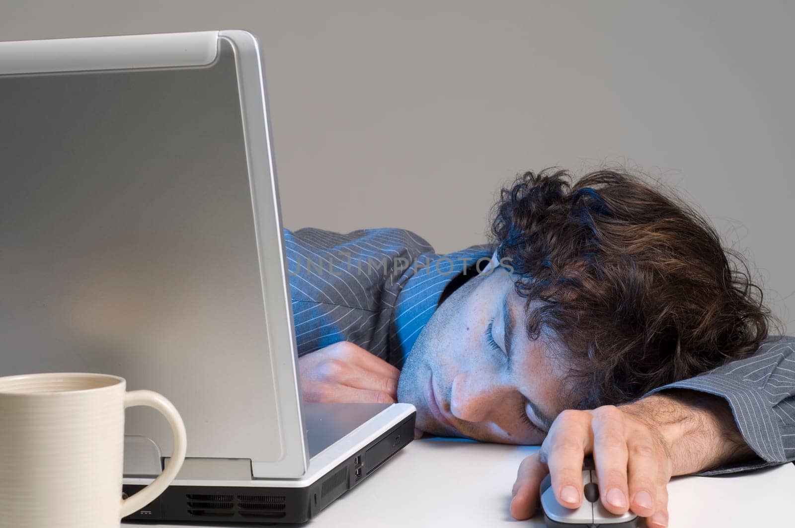 Tired man at computer desk