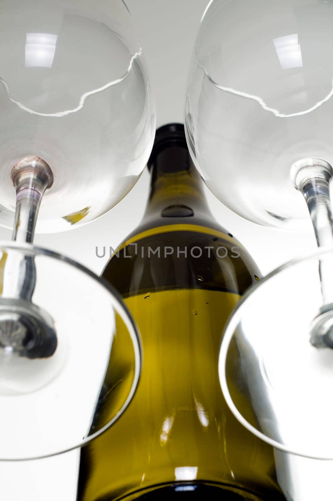 Empty wine glass and bottle