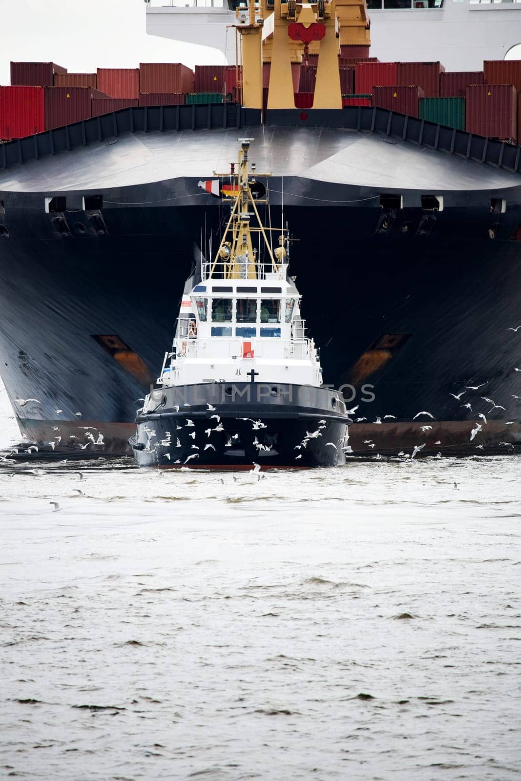 tugboat pulling freighter