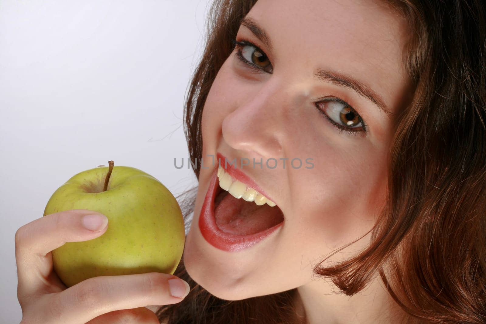 Beautiful Woman Preparing To Bite An Apple