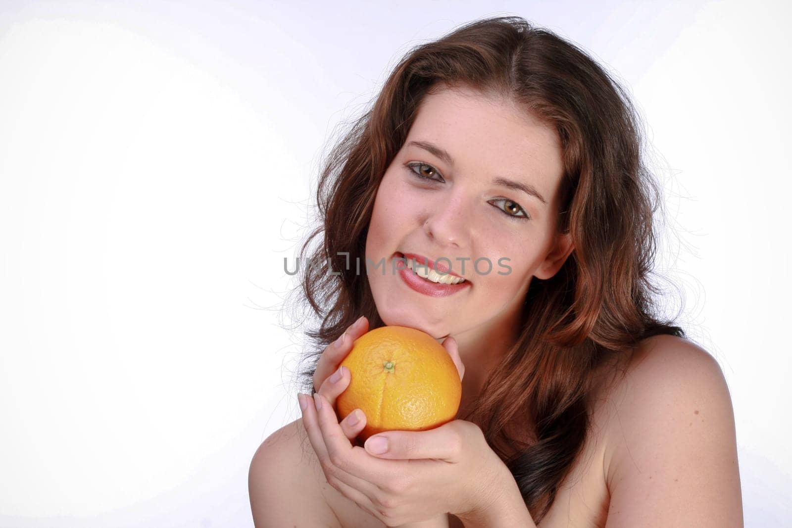 Beautiful Woman Holding An Orange