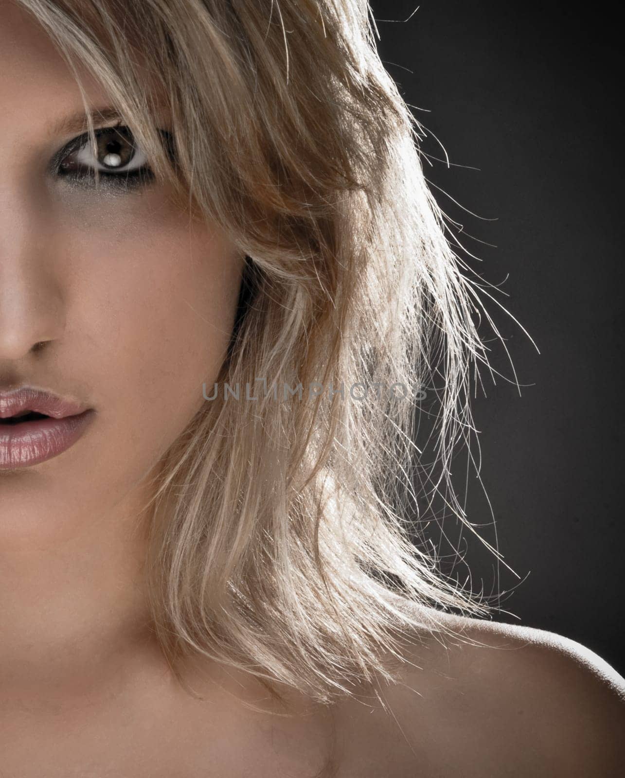 Half Face Portrait Of A Beautiful Blond Woman