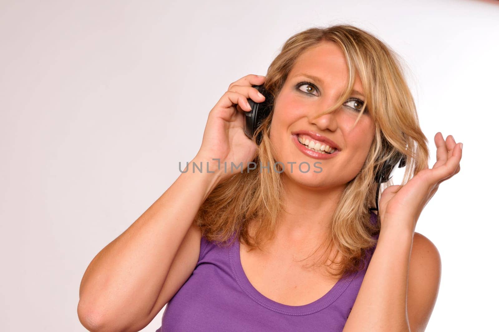 Happy Attractive Blond Woman With Headphones