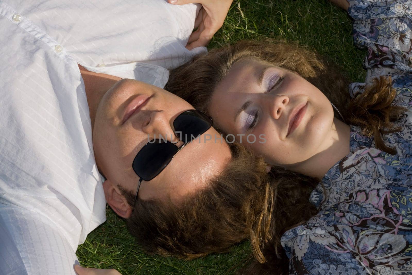 Happy Couple Lying Head To Head