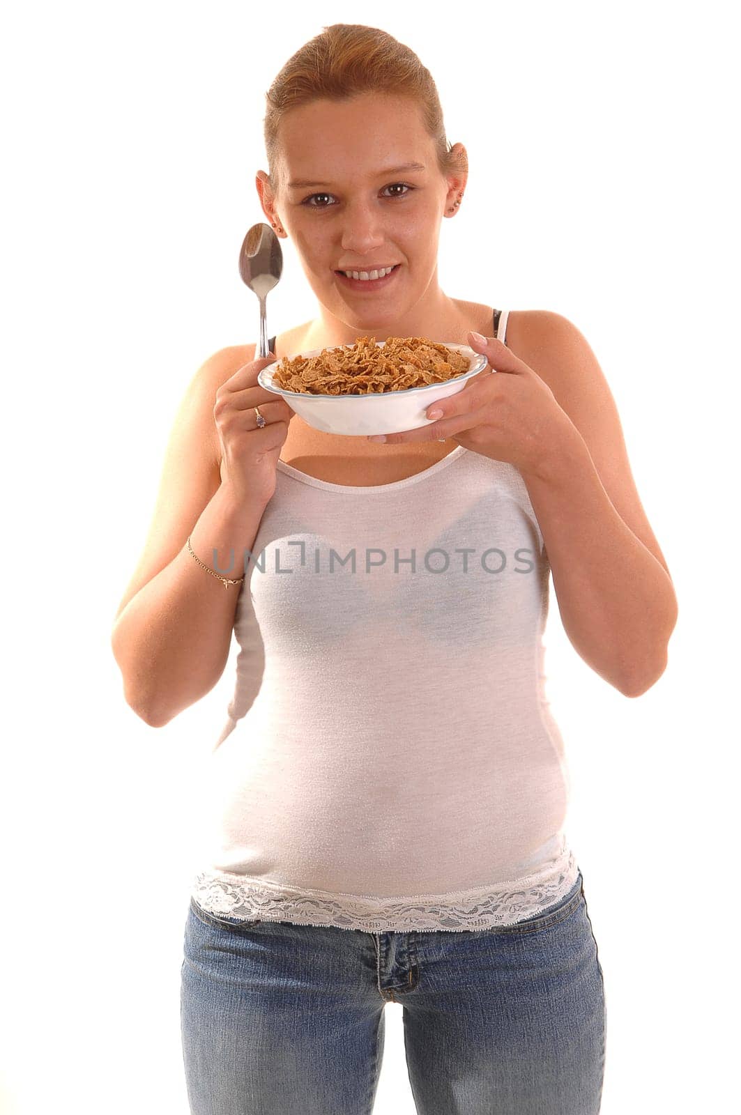 Smiling woman with cereal.
