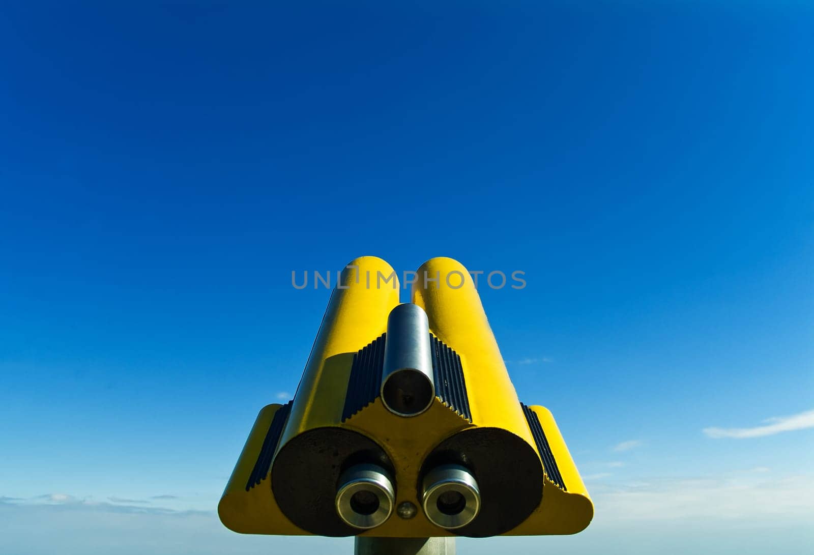 Yellow telescope,blue sky