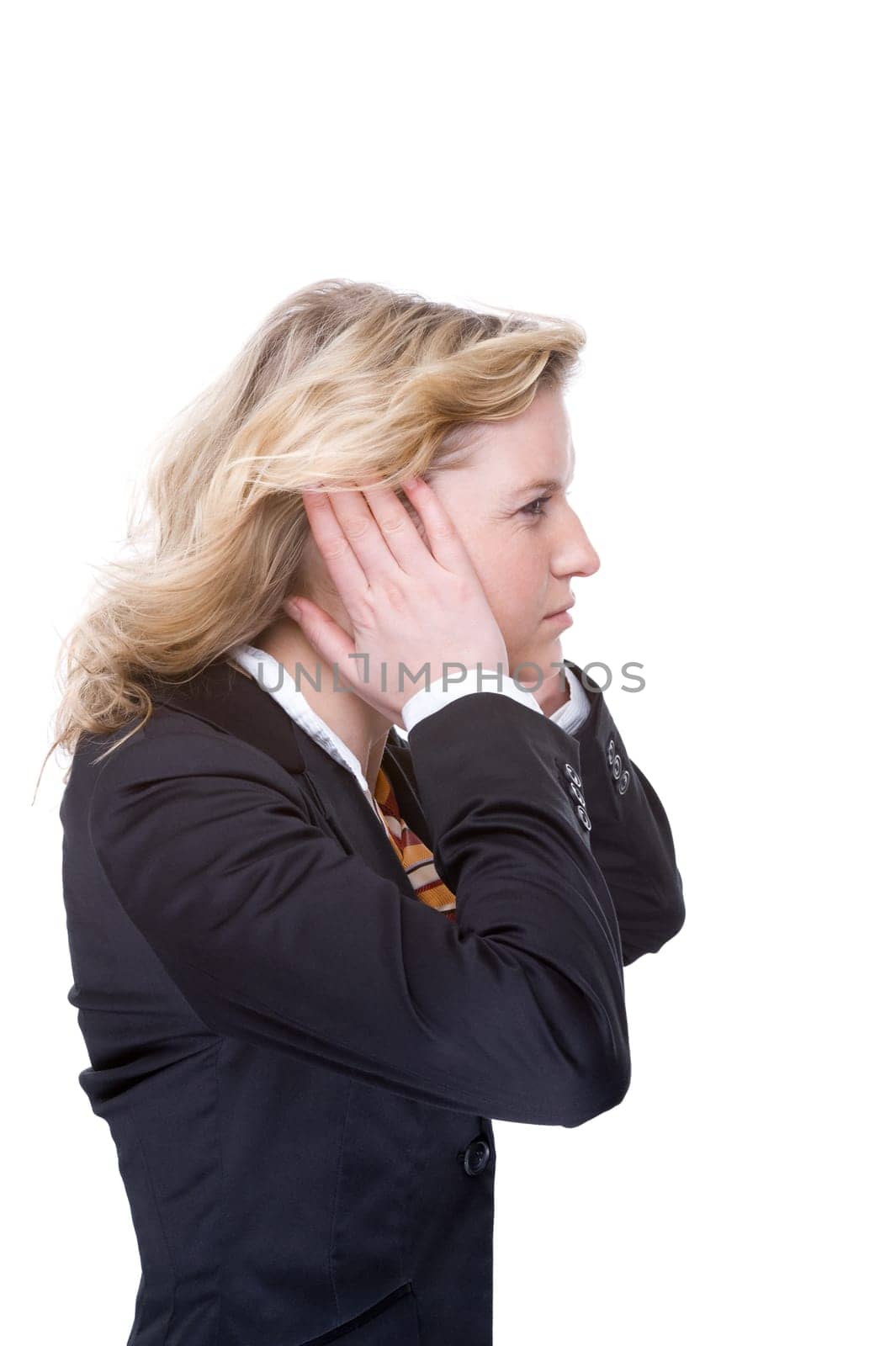 Boy covers his ears
