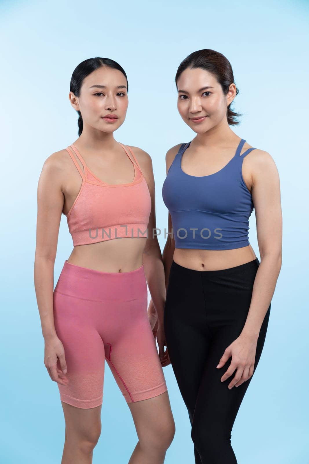 Two attractive girl engage in her pursuit of healthy lifestyle. Vigorous by biancoblue