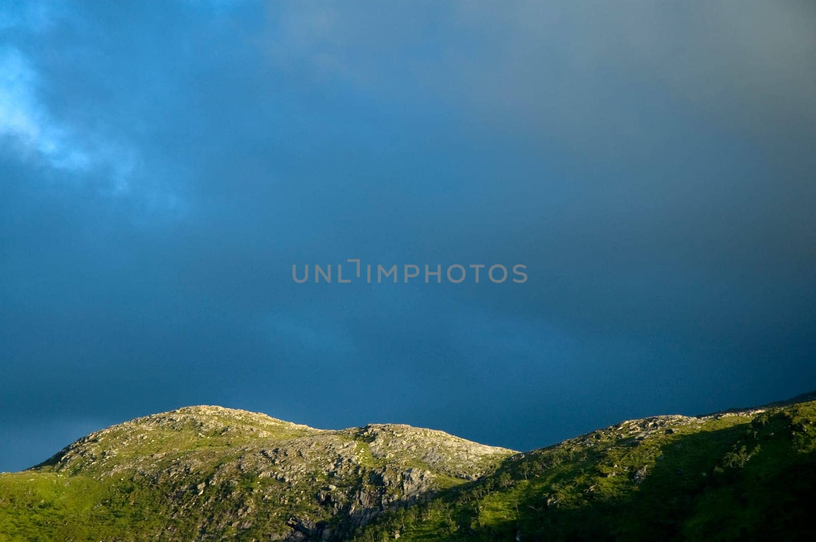 Dark clouds over a mountain