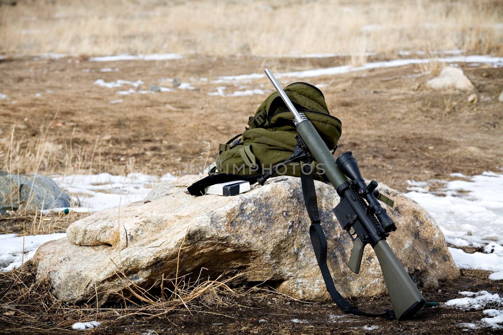 rifle on rock