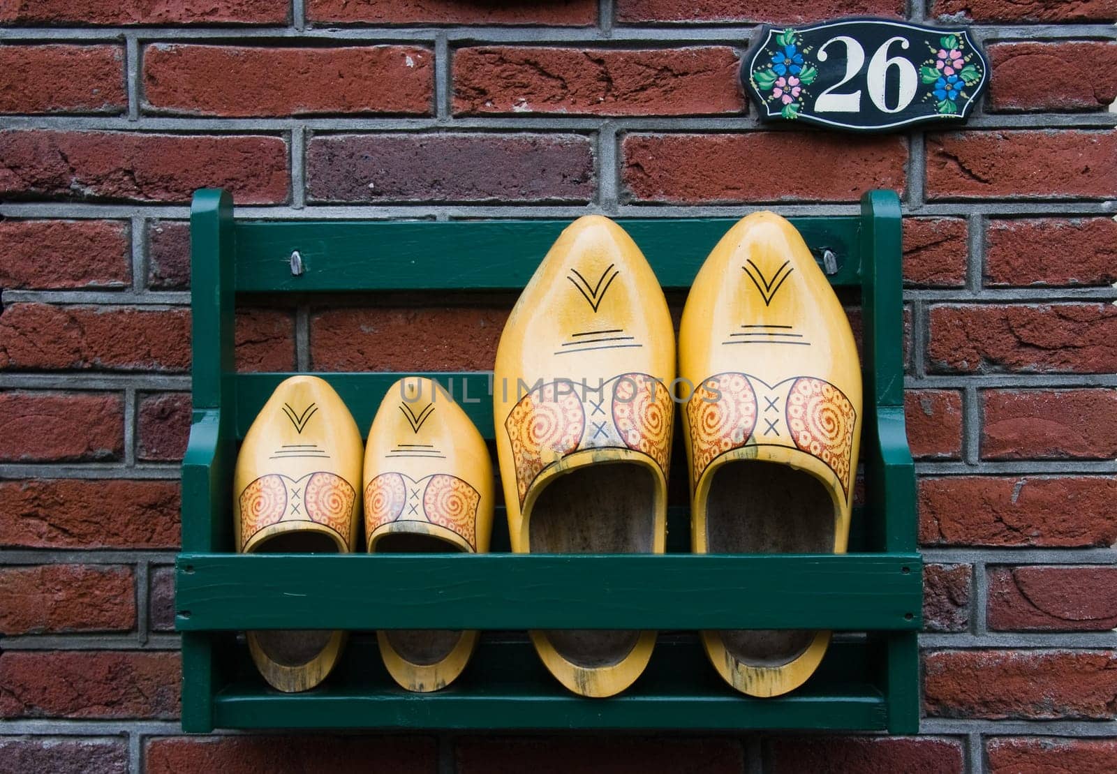 Storage rack with clogs next to frontdoor