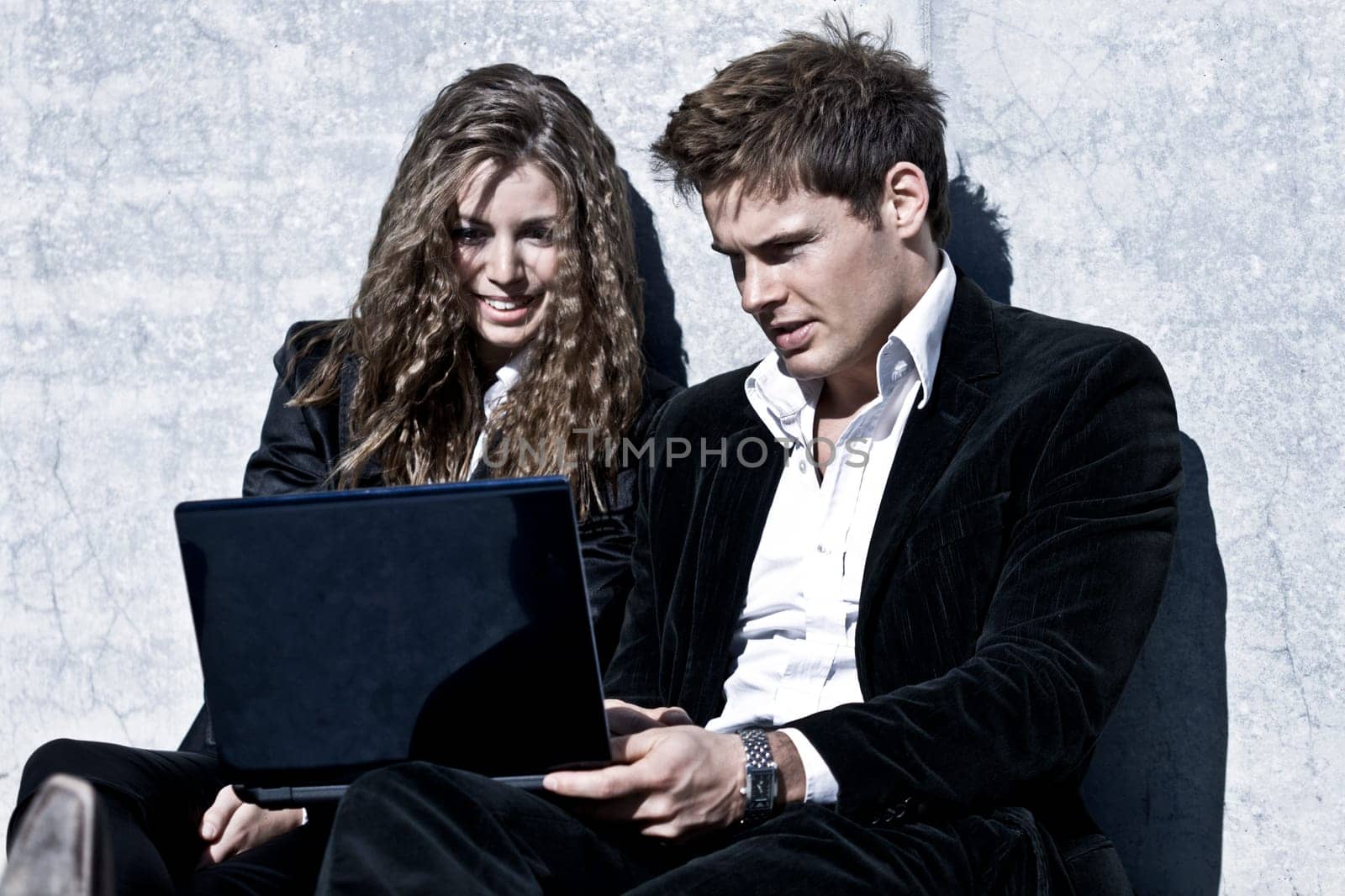 Young Corporate Couple With Laptop