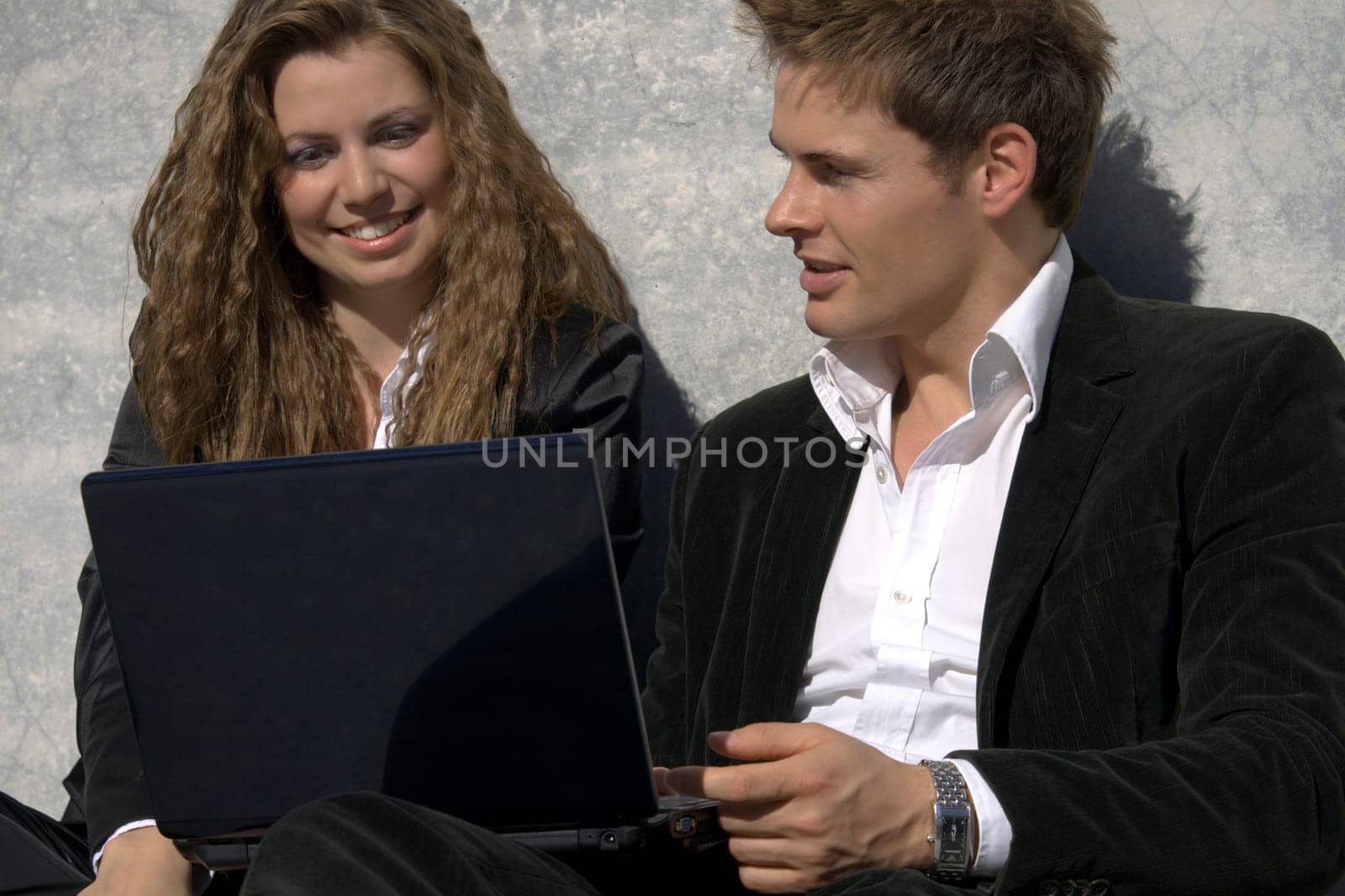 Successful Man And Woman With Laptop