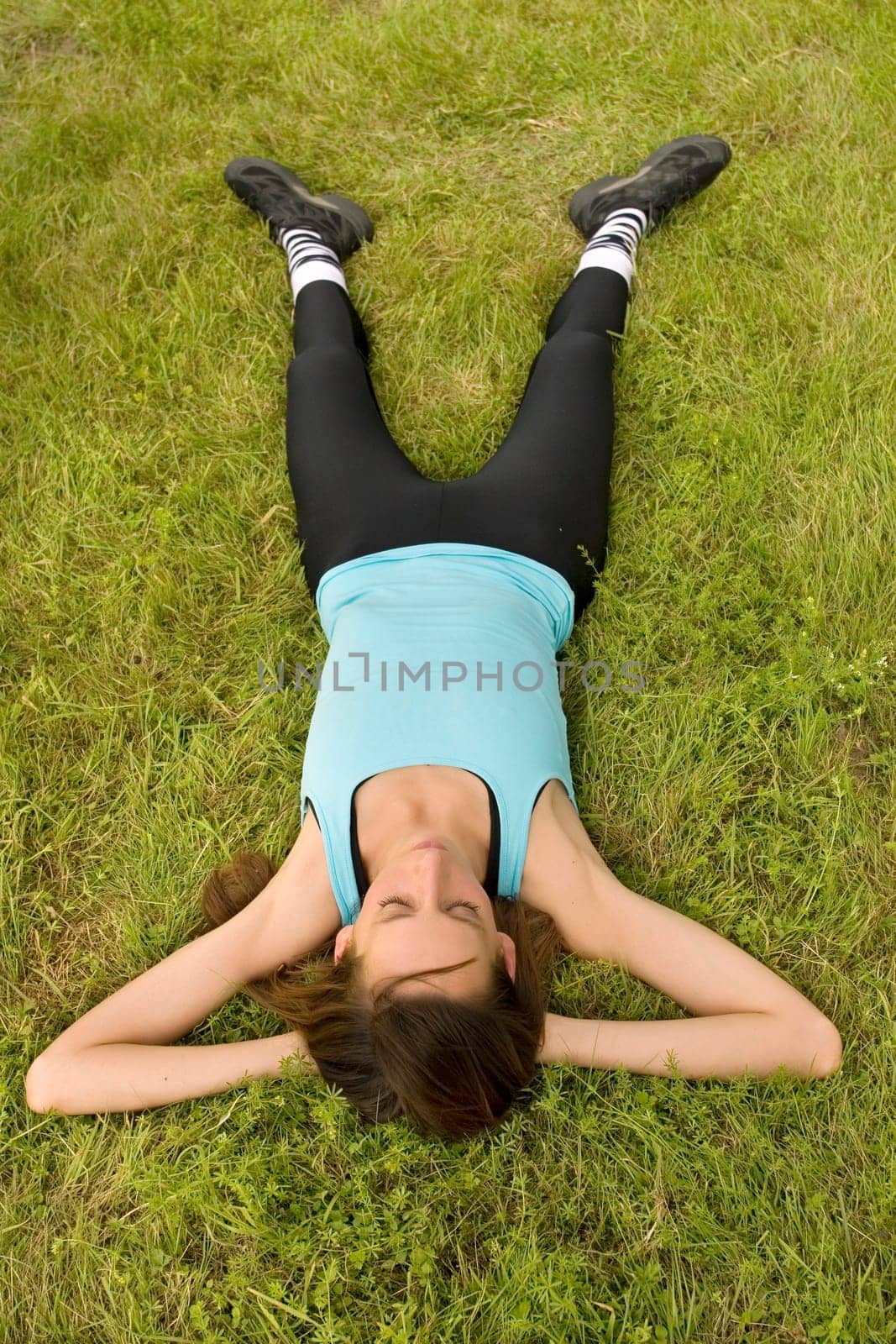 Woman relaxing on grass