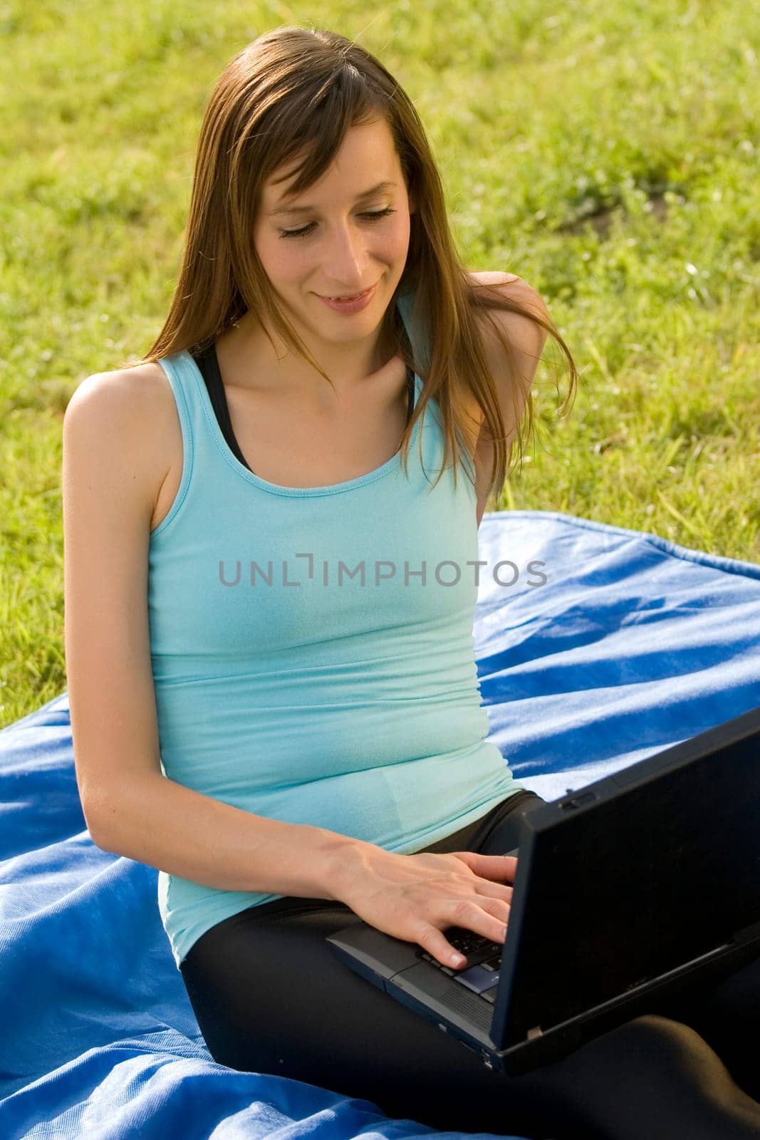 Woman with laptop working outdoor