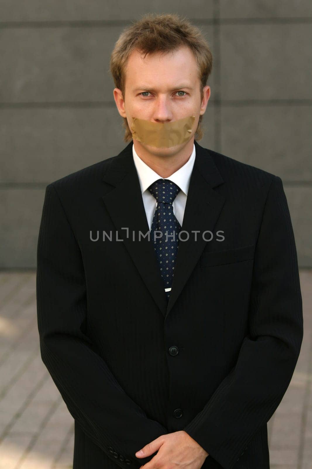 Man with adhesive on his Mouth