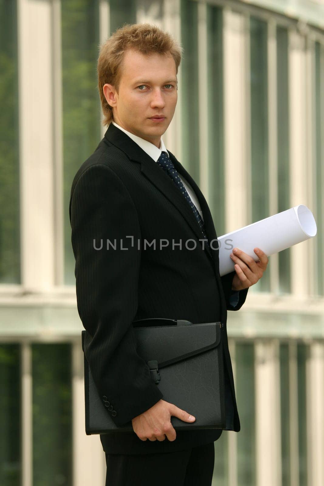 manager with bag and blueprint