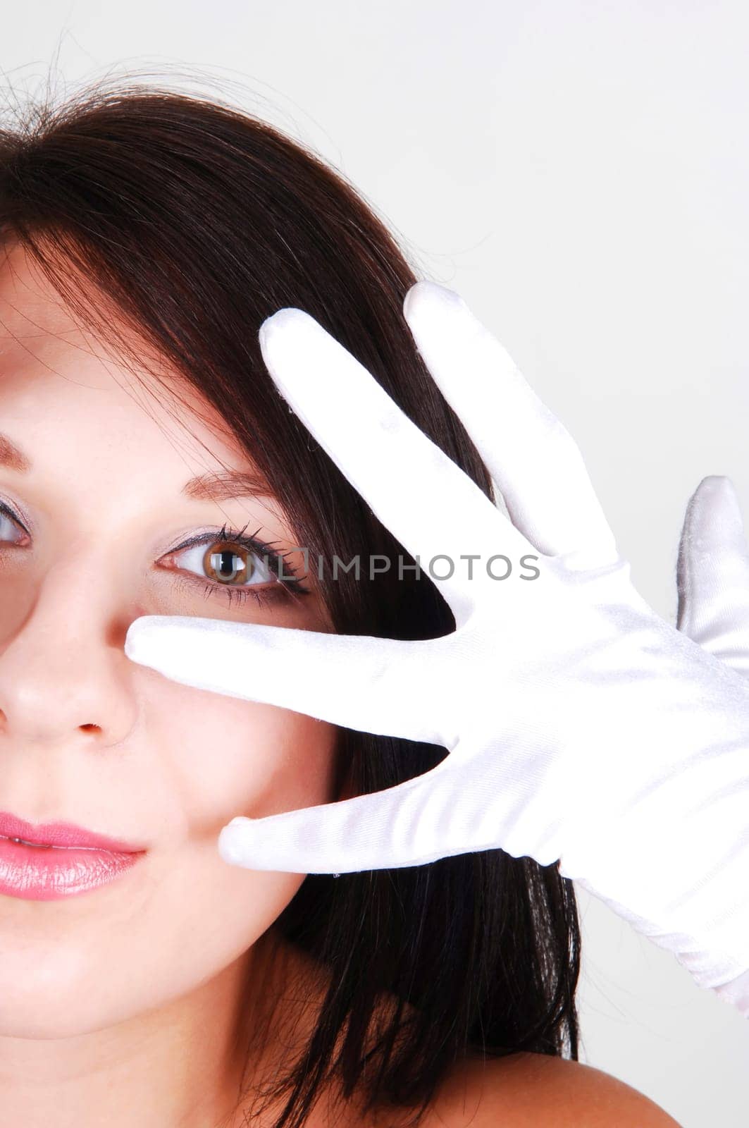 Womans face and white clove.