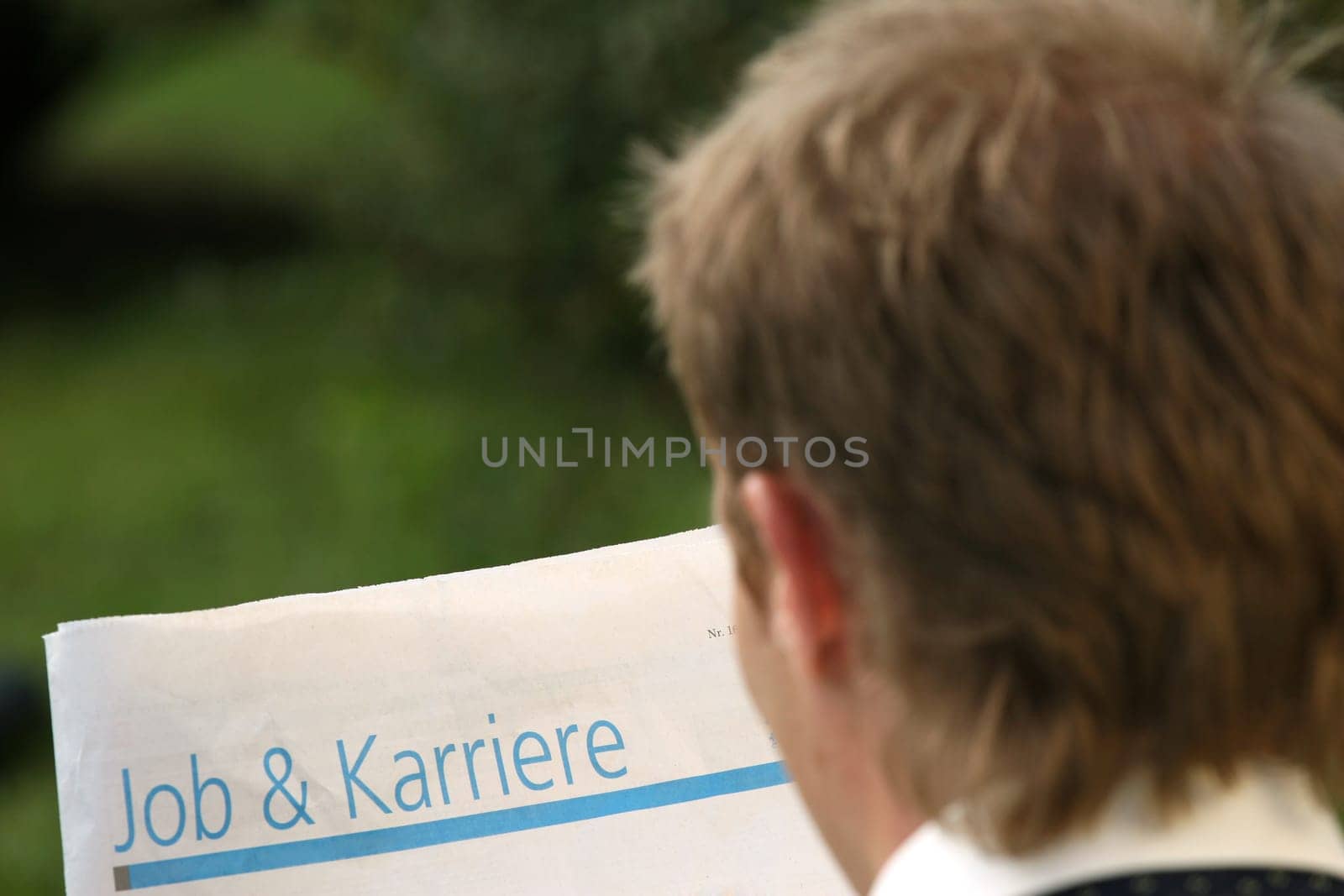 man reading newspaper