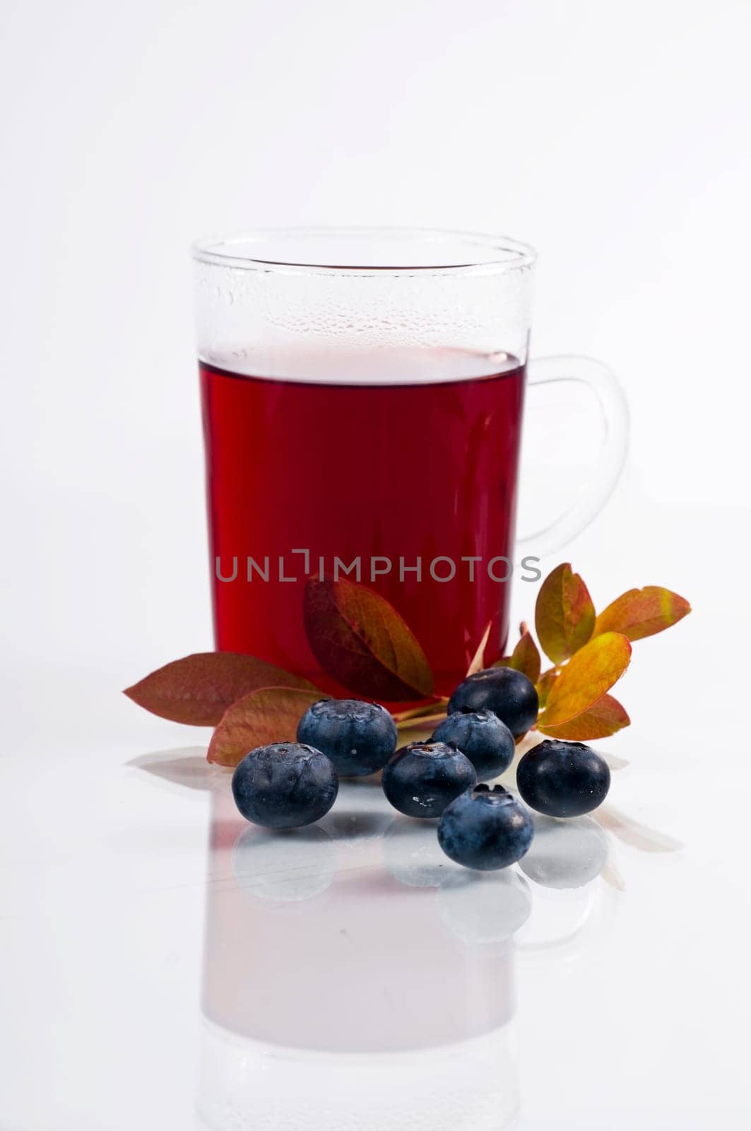 Blueberry tea on white background