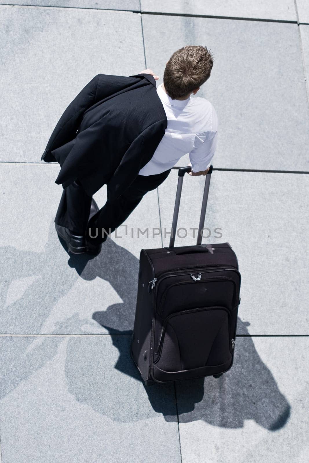 Corporate Man With Rolling Luggage