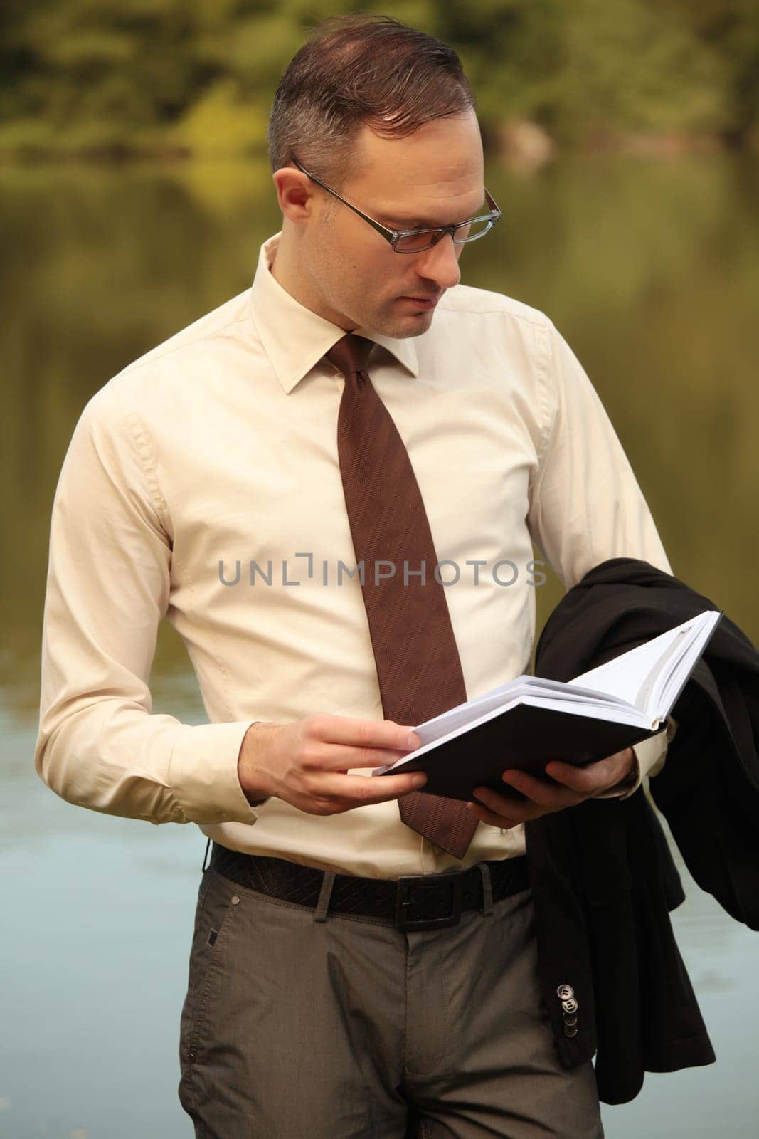 businessman looking in his organizer
