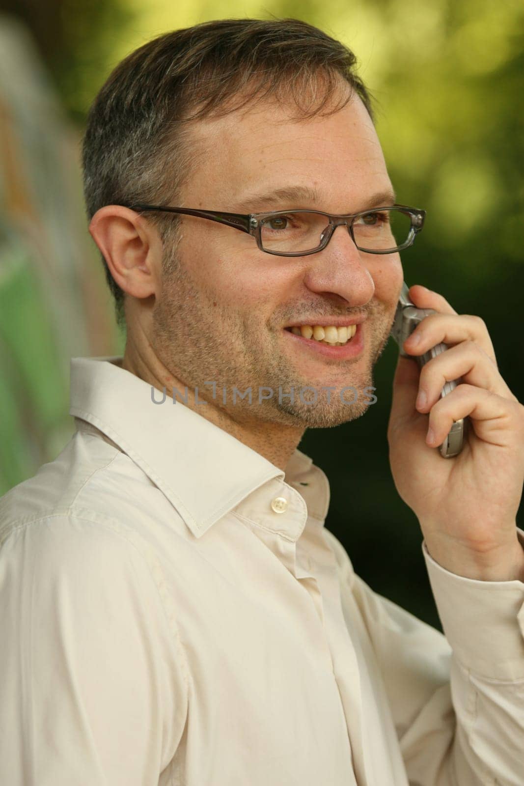 grizzled man on phone