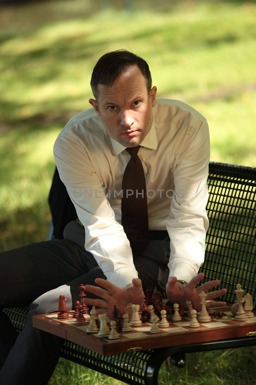 angry man playing chess