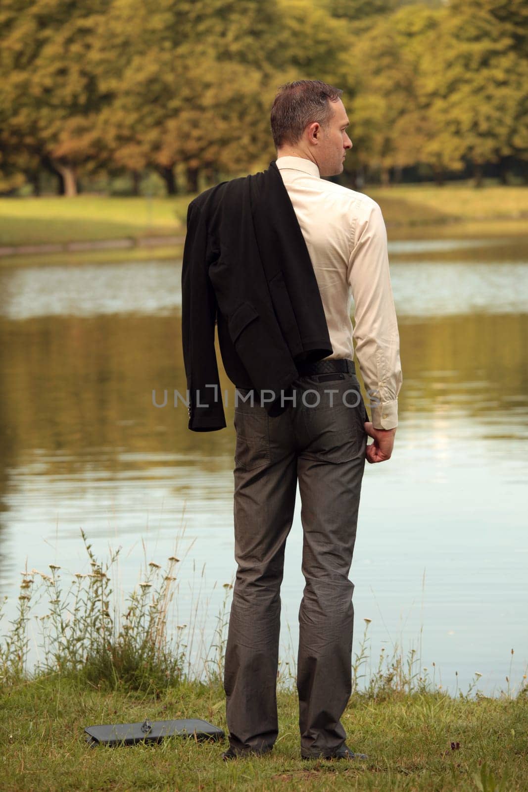 man with jacket at the shore